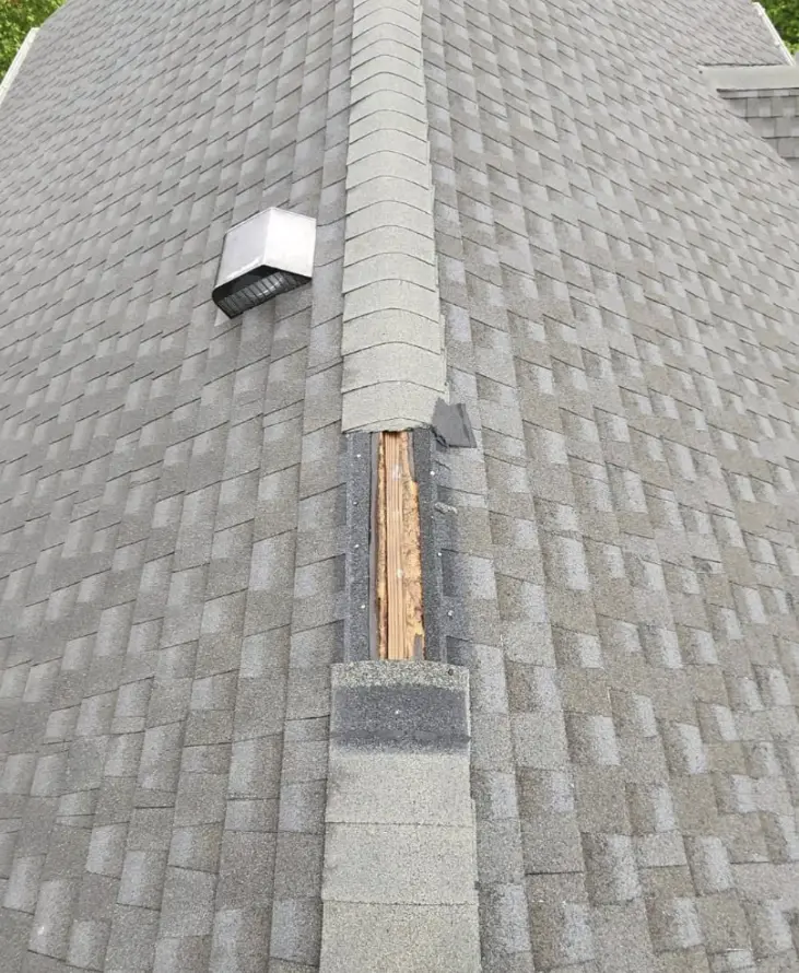 Bismarck, North Dakota roof repair service showing missing asphalt shingles and exposed wood decking, professional roofing repair by Bismarck Exterior Pros.